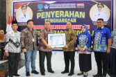 Bupati Labuhanbatu Terima Penghargaan Dari BPMP Provinsi Sumatera Utara